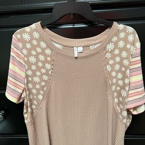 Size large super cute t shirt. Kind of patchwork look.